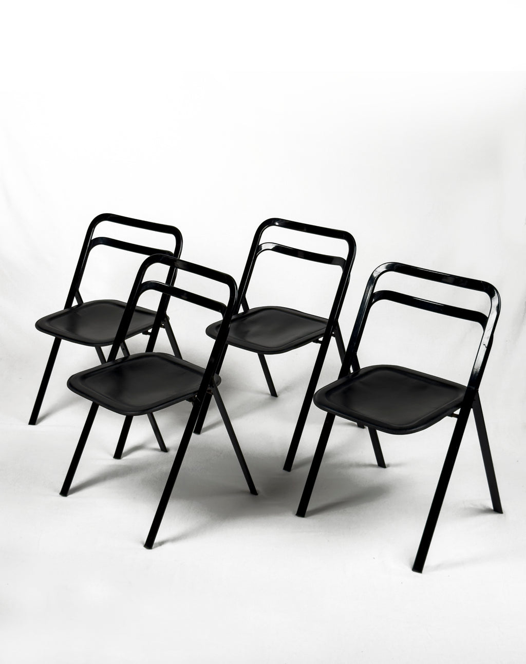 vintage metal and black leather folding “Clio” chairs by Giorgio Cattelan for Cidue, Italy 1970s