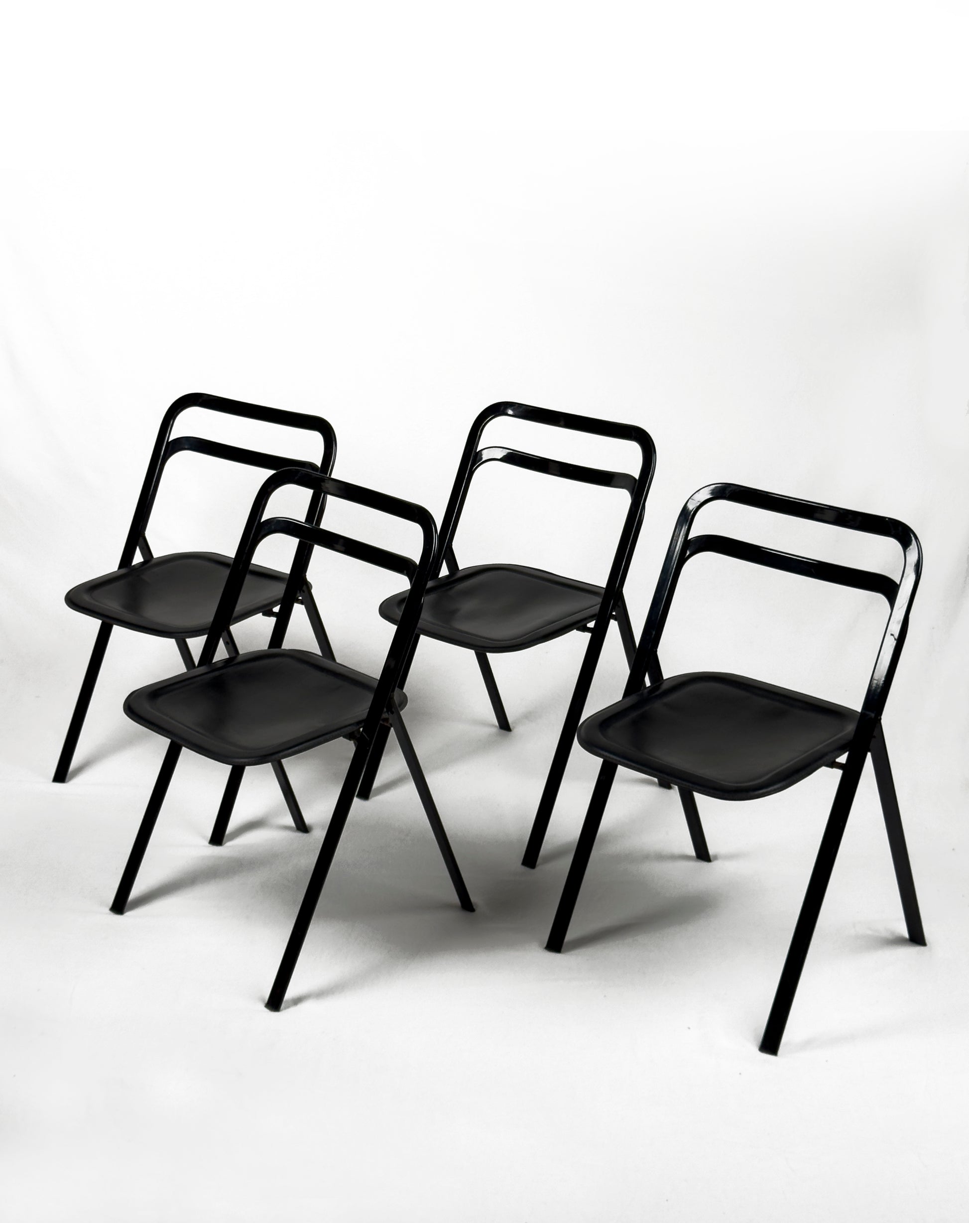 vintage metal and black leather folding “Clio” chairs by Giorgio Cattelan for Cidue, Italy 1970s