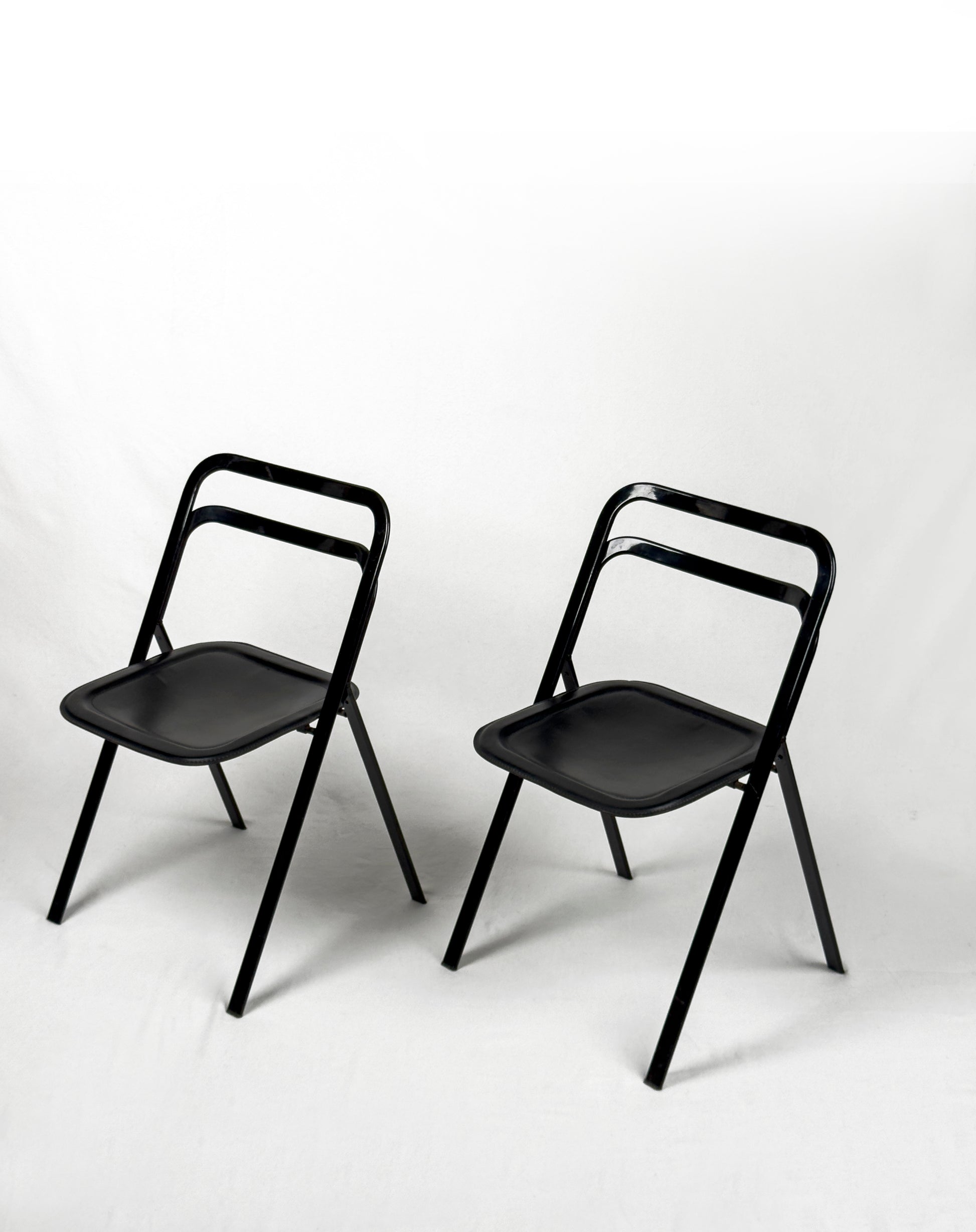 vintage metal and black leather folding “Clio” chairs by Giorgio Cattelan for Cidue, Italy 1970s