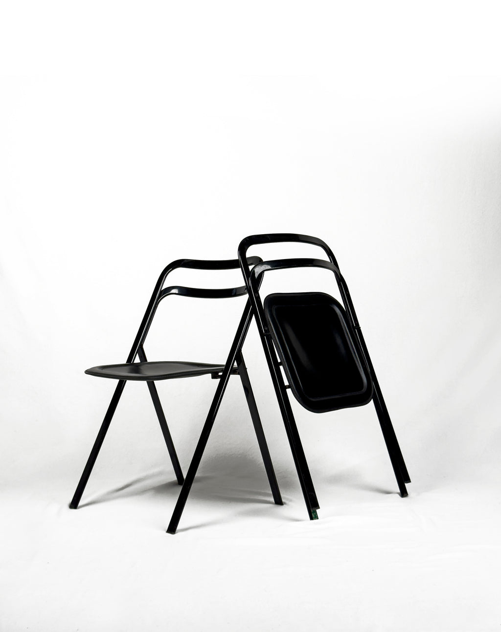 vintage metal and black leather folding “Clio” chairs by Giorgio Cattelan for Cidue, Italy 1970s
