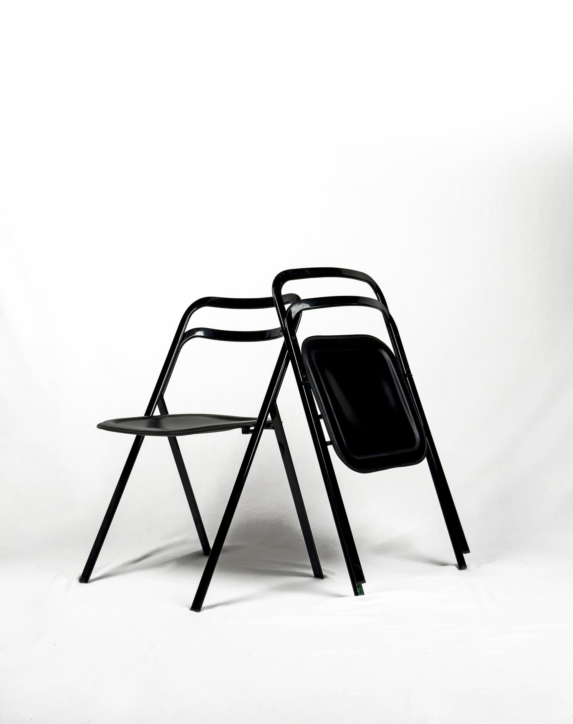 vintage metal and black leather folding “Clio” chairs by Giorgio Cattelan for Cidue, Italy 1970s